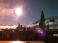  The sun shines on one of the restaurant/bar areas. Shot taken through a ski mask.