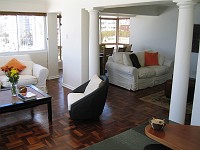  Standing in the kitchen looking towards the combined dining and entertainment area.