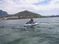  Keith on Jetski, edge of Table Mountain in the background.