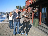  The boys consume their ice cream while waiting for the ferry