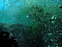  Bubbles are streaming out of the entrance - Diver visible behind bubbles