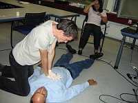  Jamie simulates CPR on Eric