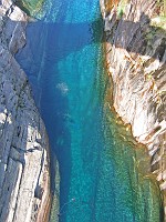  Divers visible under the clear waters of the Roman Bridge